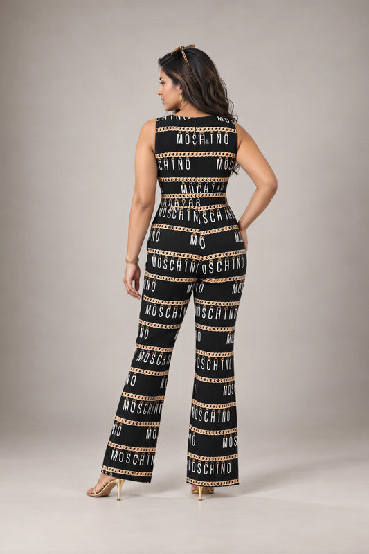 Chain Link Jumpsuit: black sleeveless flared-leg jumpsuit with a gold chain and lettering print, back view