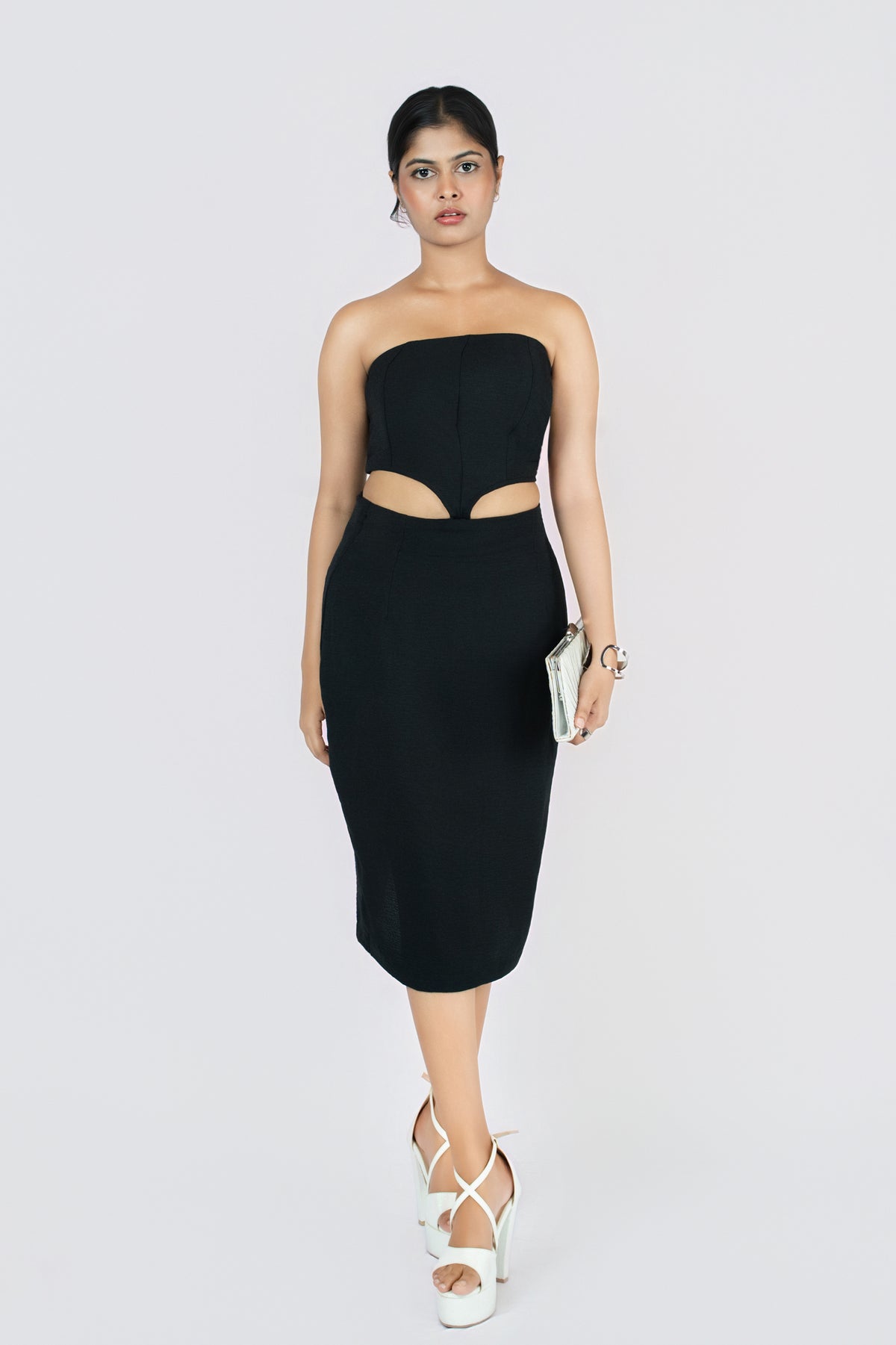 Velvet Eclipse Cutout Dress: black strapless fitted midi dress with waist cut-outs, front view