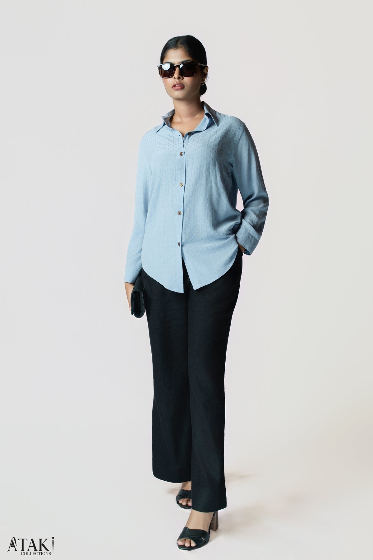 Blue Box Weave Shirt: sky blue textured-weave long-sleeve cotton shirt, worn with black trousers, front view