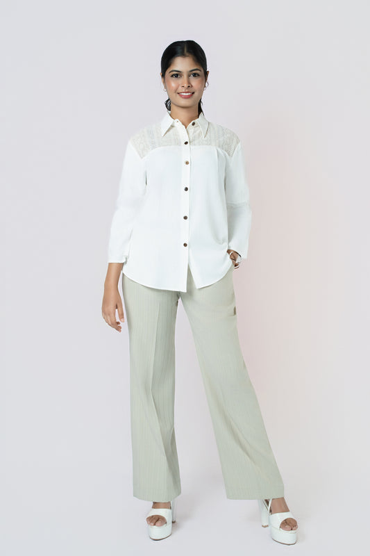 Ivory Textured Panel Blouse: ivory long-sleeve button-up blouse with textured lace panels, worn with sage trousers, front view