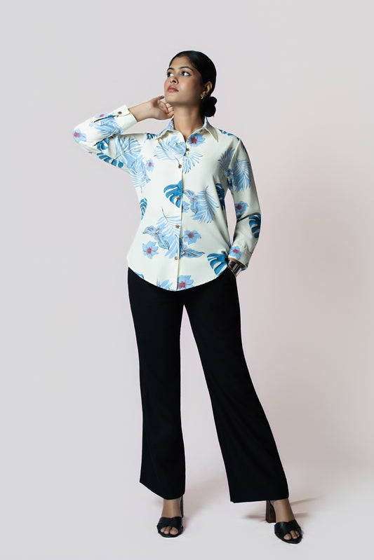 Midnight Grace Wide-Leg Trouser: black wide-leg trousers with a fluid drape, front view, styled with a leaf-print shirt