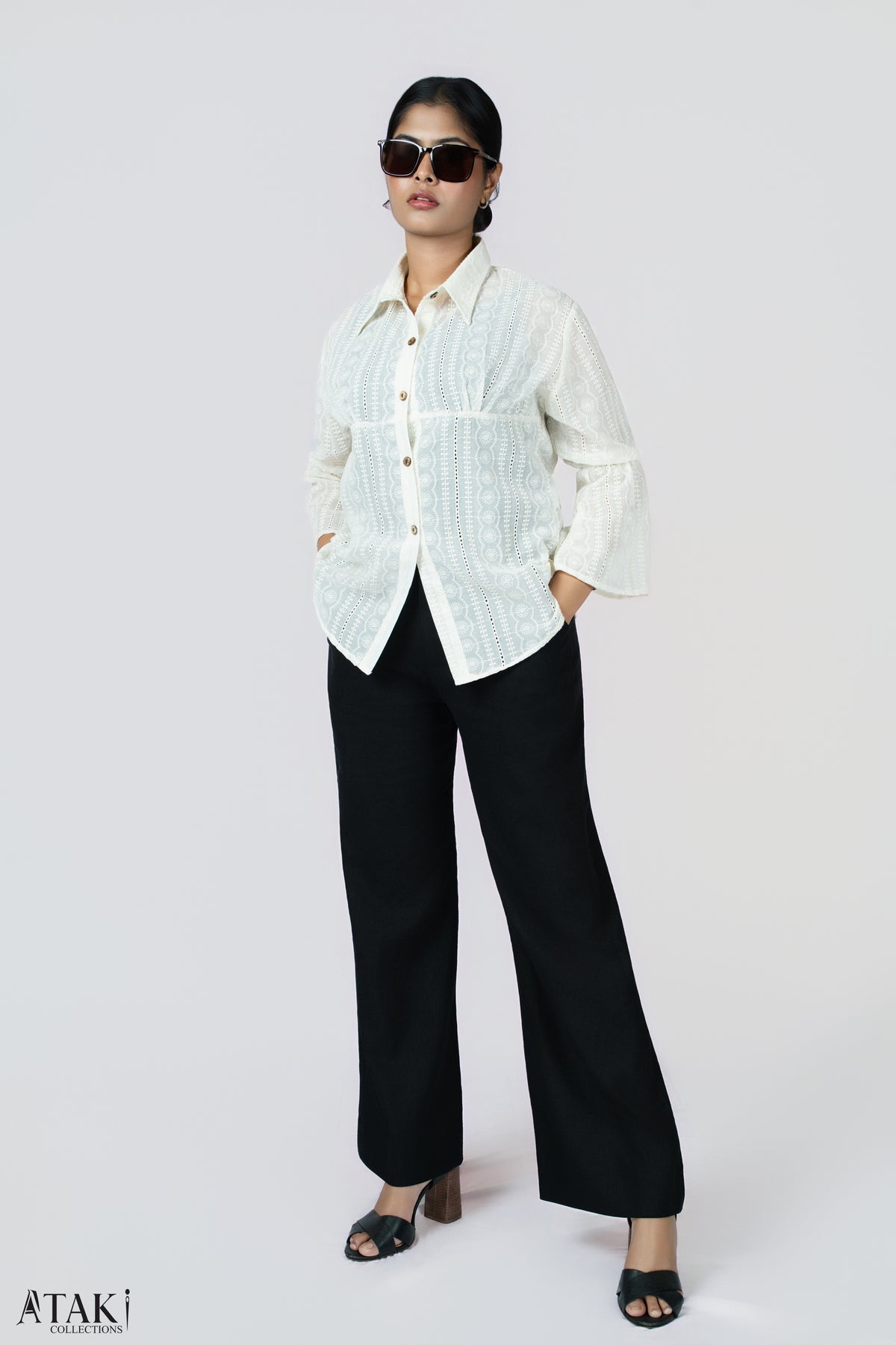 Ivory Grace Lace Blouse: ivory button-front blouse with lace panels and bell sleeves, worn with black trousers, front view