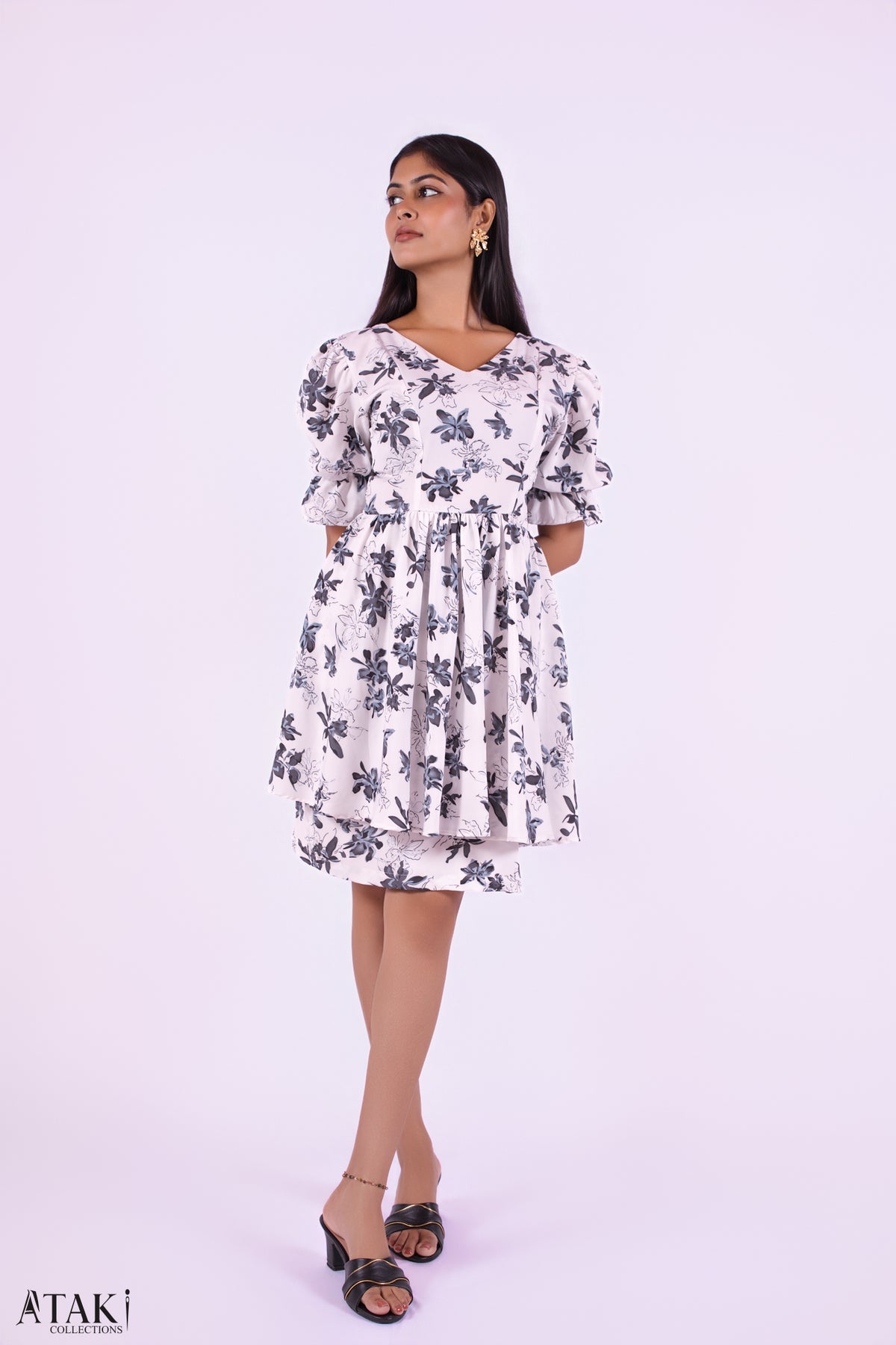 Luna Bloom Puff Sleeve Dress: white mini dress with a black floral print and puff sleeves, front view